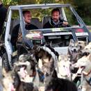 Crown Prince Haakon gets to try an electric car drawn by dogs at he Tyrili Foundation (Photo: Lise Åserud / Scanpix).